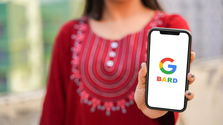 woman holding phone with Google Bard on display