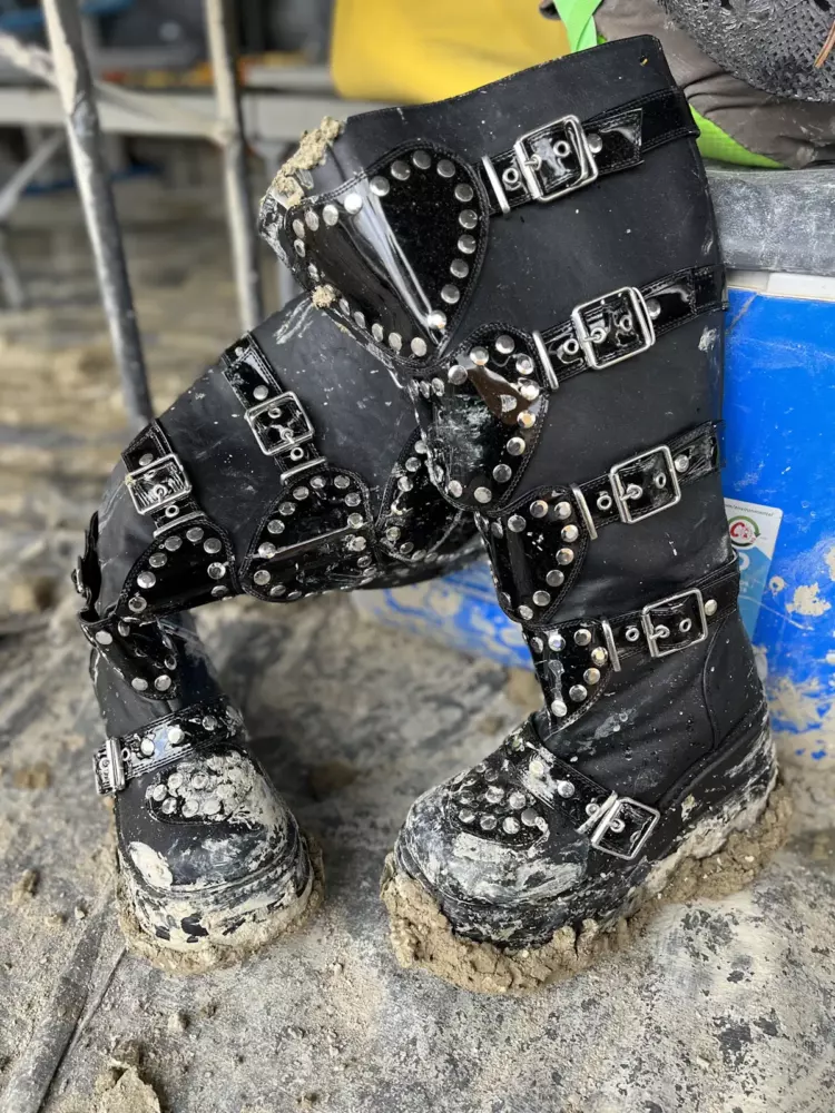 burning man tech - boots in mud