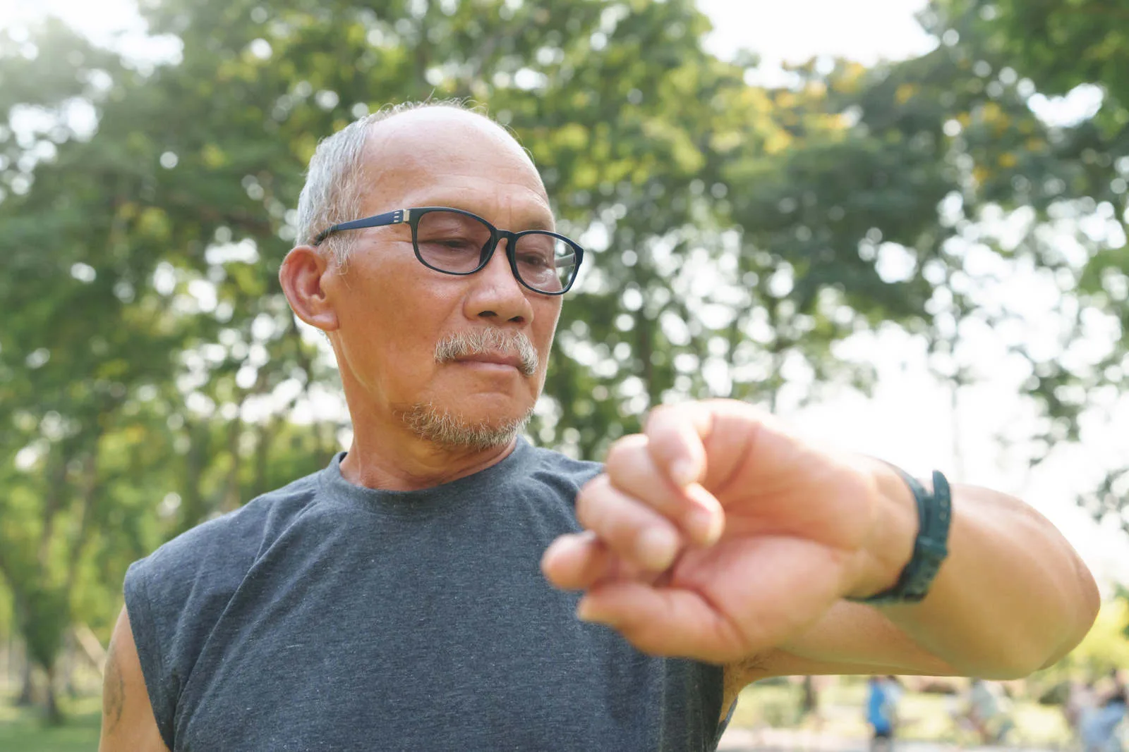 Google Gemini health check - older man checking his fitness watch
