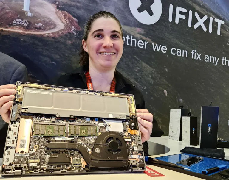 Brittany McCrigler, iFixit Vice President of Manufacturer Solutions, holding a repairable laptop
