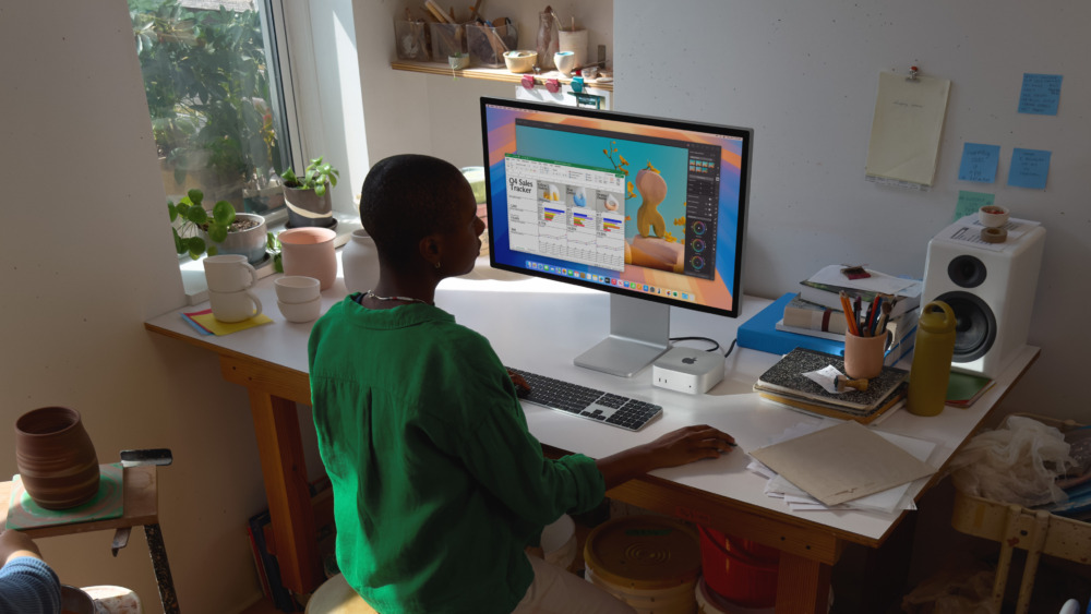 Apple promo image of the Mac mini at use in a small business scenario.