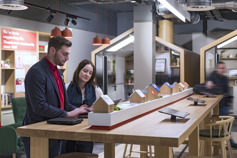 private cloud HPE GreenLake shown by two people in Nationwide brand looking at screens