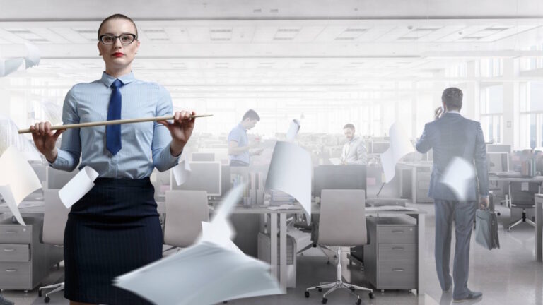 security lessons to learn from 2024 shown by stern teacher standing in front of messed-up office