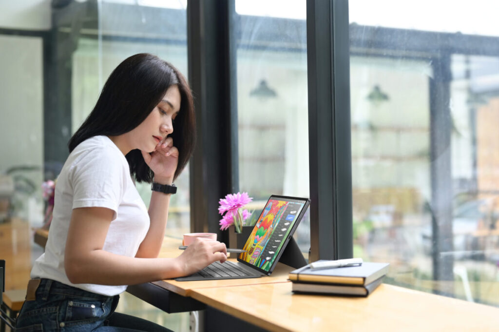 Tablets unveiled at IFA 2025: Acer Iconia X12 being used by young creative woman
