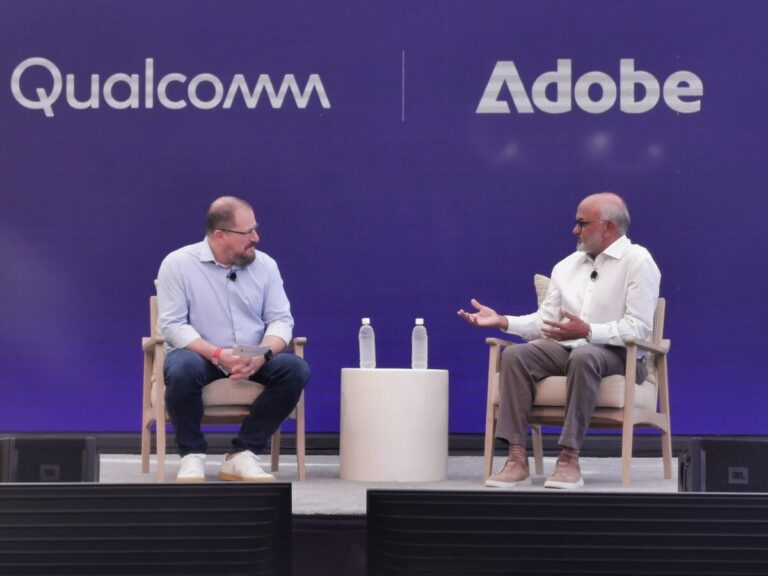 Qualcomm and Adobe's CEOs talking on stage at the Snapdragon Summit 2025