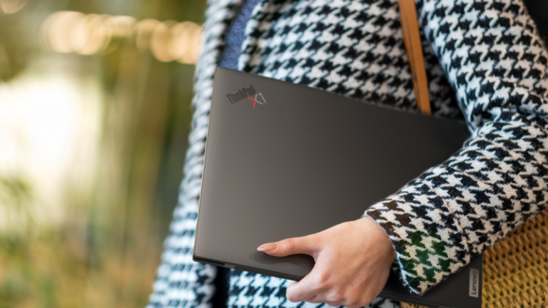Refurbished Laptops business - ThinkPad X1 Carbon under woman's arm