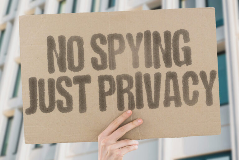 Digital sovereignty trend shown by hand holding poster saying โNo Spying. Just Privacyโ