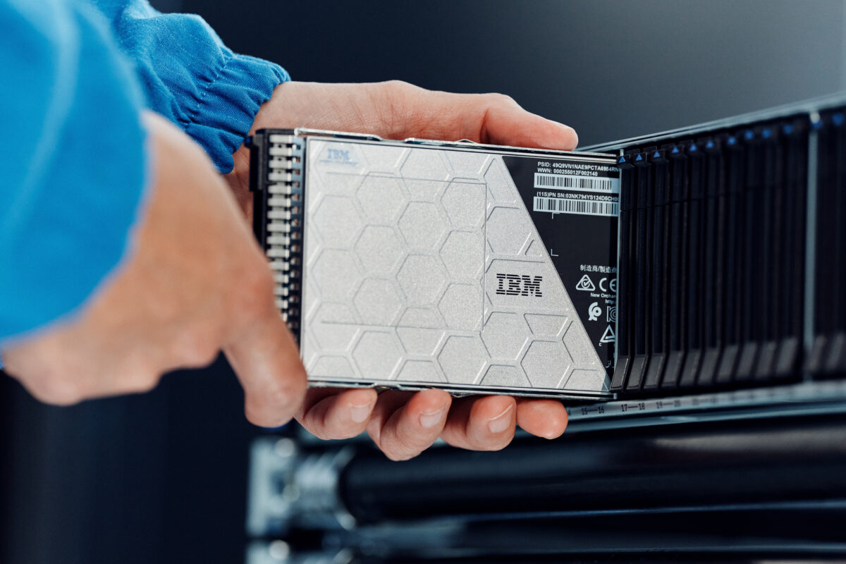Man sliding flash module into IBM FlashSystem