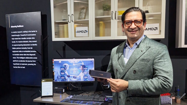 rahul tikoo holding the AMD Ryzen AI Halo dev box at ces 2026