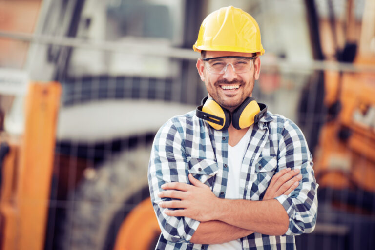 AI boom jobs shown by Young construction worker in hard hat