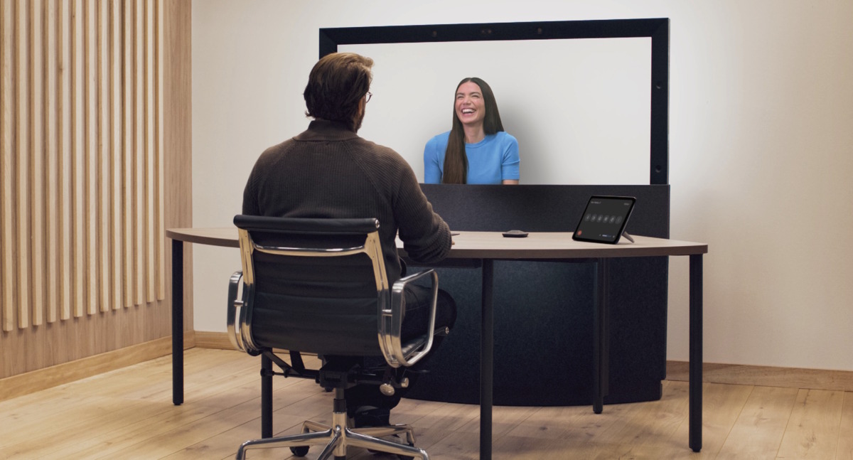HP Dimension with Google Beam setup - man at desk, woman laughing in screen