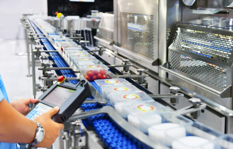 CPG manufacturers industrial AI increase shown by manager checking control automation of food products on automated conveyor systems in factory