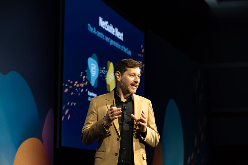 Patrick Puck, NetSuite GVP, AI Strategy, Engineering and Design, on stage at SuiteConnect London