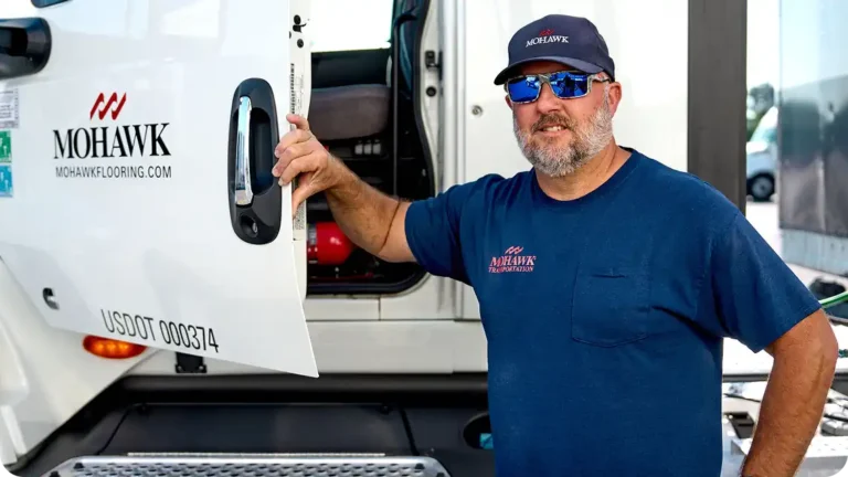 Samsara Driver Cup competition illustrated by photo of a truck driver standing next to his cab