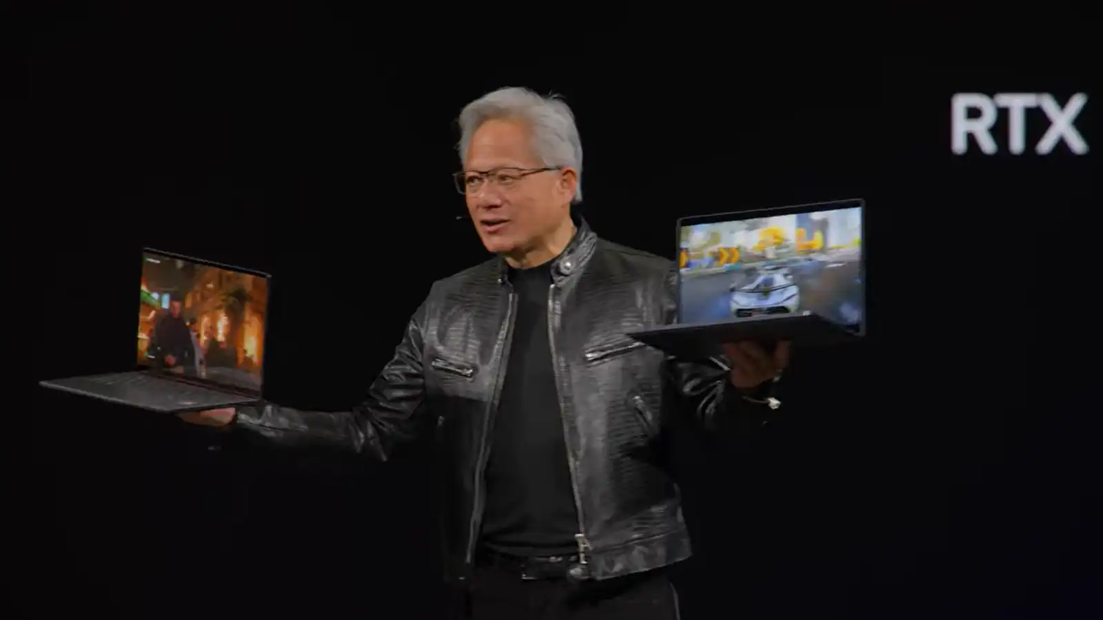 Jenson Huang on stage with Nvidia's first Windows laptops