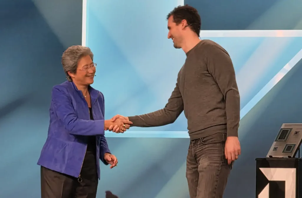 Dr Lise Su shaking hands with Anthropic Co-Founder and Chief Compute Officer John Brown to(image: TechFinitive)