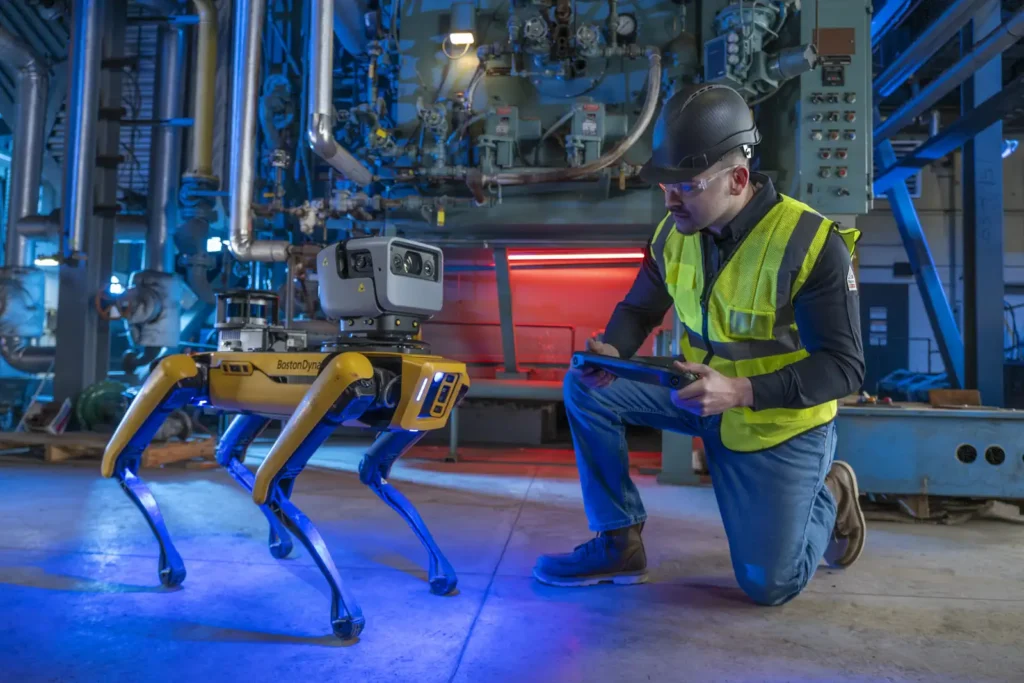 Spot, Boston Dynamics' original robot, working in an industrial setting