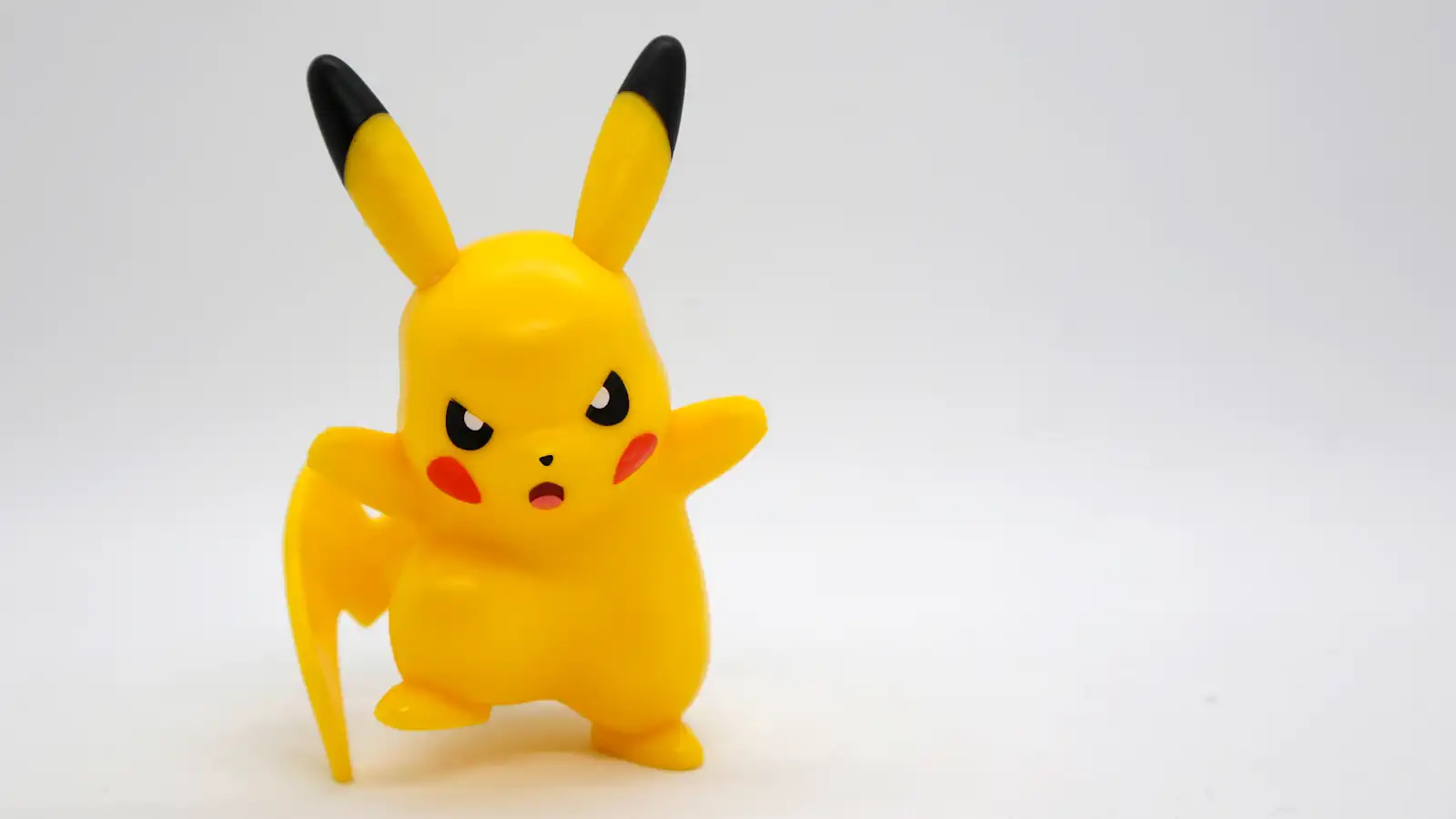 angry pokemon figure against white background