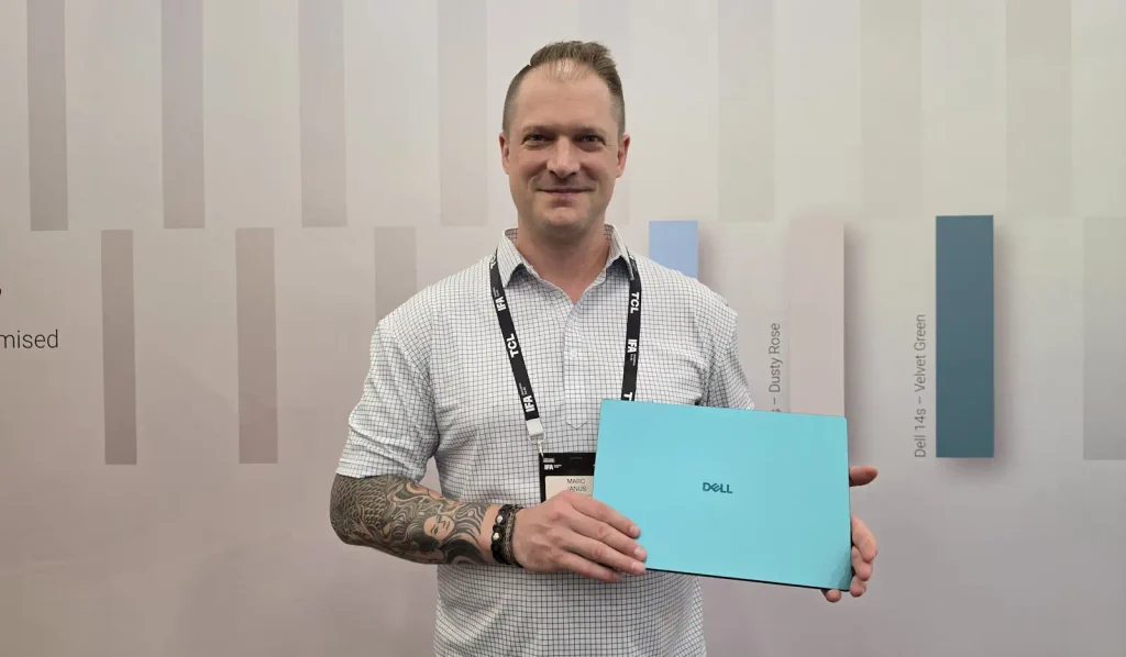 Marc Janus holding the all-new Dell 14S
