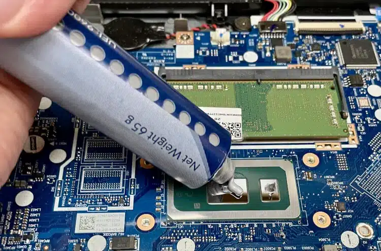 thermal compound being applied to laptop cpu